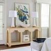Pair of Hopper Lamps on beige console with a large framed bird artwork and bright window light