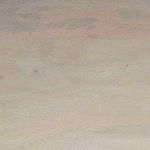 Close-up of smooth mango wood grain and subtle natural color variations on bar table surface