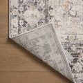 Corner flipped over revealing the rug’s underside and weaving structure