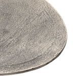 Close angle emphasizing the rounded tulip pedestal base design and texture