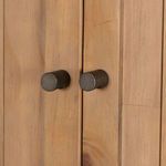 Detail of round matte black knobs on the doors of Knightdale Brown Wooden Cabinet