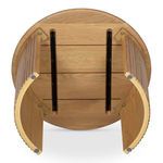 Underside view showing metal supports and wood joinery of round oak coffee table