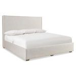 Sawyer Storage Panel Bed with light beige fabric upholstery, stitched flanged edges, and wood feet in Morel finish