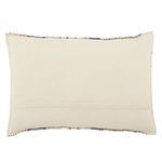 Backside of lumbar pillow in plain cream fabric with stitched seams and concealed zipper
