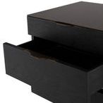 Close-up of the top drawer partially open, showcasing brass pull and interior storage