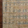 Close-up of Bowery beige multi rug on wooden floor emphasizing subtle pattern and color mix