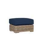 Havana Ottoman with rich aged tobacco all-weather wicker base and thick navy blue cushion