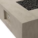 Close-up on side control panel inset into textured concrete surface of fire table