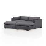 Alternate angle showing left chaise seating with plush cushions and right armrest detail