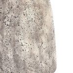 Close-up of the curved base showing detailed texture and color variations in the concrete