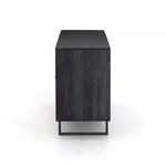 End view showing black mango wood grain on side panel of Carmel Cane Sideboard