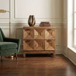 Musashi Walnut 2 Drawer console table in bright room next to green chair and window with decorative vase and books on top