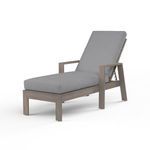 Laguna Chaise Lounge with hand-brushed aluminum frame mimicking driftwood and grey outdoor cushion