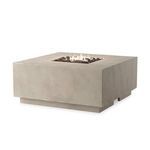 Donovan fire table side angle view showing solid rectangular monolithic pewter concrete form with lava stone fire pit