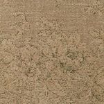 Close-up texture of the brushed tan fabric upholstery with subtle floral pattern