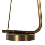 Close-up of Egon floor lamp’s round brass base and hexagonal frame connector