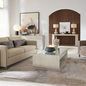 Living room context with the end table placed beside a sofa, showing its scale and modern decor environment