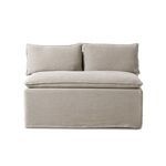 Armless slipcovered dining bench in neutral flax linen with feather-blend cushioning and flanged top seams
