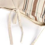 Top angle of tied fabric strips with visible striped pattern on pillow front