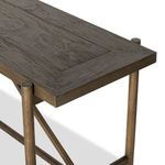 Detailed view of underside frame and diagonal metal brace on pine console table