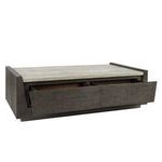 Coffee table side view with front drawers partially open showing dark wood drawer interiors