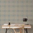 Wallpaper shown in room setting with desk and chair, highlighting full wall coverage and scale of plaid pattern