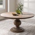 Table styled in bright dining room setting with decorative vase and bowl on tabletop