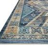 Close-up side angle showing thin edge and low-pile texture of Zion Ocean Gold Rug