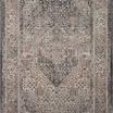 Traditional power-loomed Lyra Denim Pebble rug with watercolor-inspired soft blue and beige tones and intricate central me...