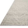 Close-up side angle showing rug's textured geometric design and sturdy pile edge