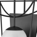 Close-up of black metal frame joints and globe connection on Rochefort sconce