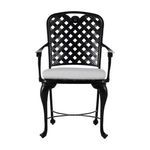 Straight-on back-facing perspective highlighting chair's symmetrical armrests and lattice back