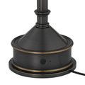 Close-up of lamp base with power button and indicator light off, showing detail of bronze trim