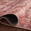 Side view of Loren rug slightly rolled up illustrating thickness and soft polyester base texture