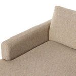 Angle showing chaise seat cushion depth and wooden legs beneath