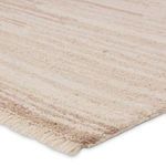 Close-up showing the wool pile texture and fringe detail with natural and cream stripes