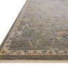 angled close-up showing rug pile height and detailed floral pattern with fringe