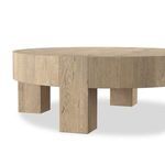 Close angled view emphasizing the thick squared leg and side panel texture of oak veneer