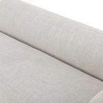 Close-up of back cushion and seat junction showing tight weave fabric in light beige