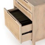 Close-up on top corner joins and cane drawer fronts showing wood grain and texture