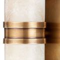 Detail of two natural brass rings encircling alabaster shade center section