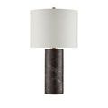 Top edge of white fabric drum shade with polished antique brass finial visible