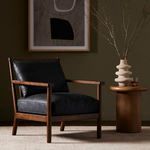 Jamison chair styled in room setting with abstract wall art and decorative table