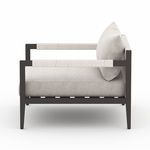 Side profile of Sherwood chair showing rope-wrapped armrests and thick seat cushion