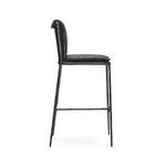 Side view of Mayer Stool showing slim leather seat cushion and rolled leather backrest profile