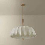 Flinders pendant shown mounted in a room with neutral walls, pendant turned off