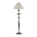 Floor lamp with beige tapered shade photographed front-on against white background