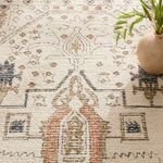 Decorative vase on rug corner highlighting pile texture and soft transitions between color tones