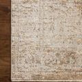 Close-up of rug edge on hardwood floor revealing subtle color variations and fringe detail