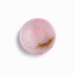 Top-down view highlighting cloudy pink interior with amber-brown vein detail inside the bowl